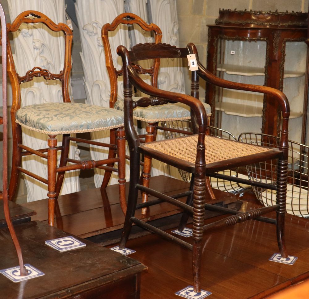 A Victorian simulated rosewood elbow chair and a pair of balloon back side chairs